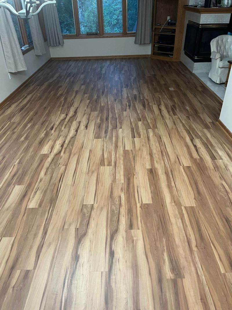 medium toned hardwood flooring in a living room