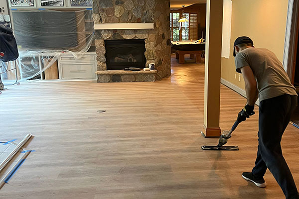 newly finished hardwood flooring in a living area with fireplace