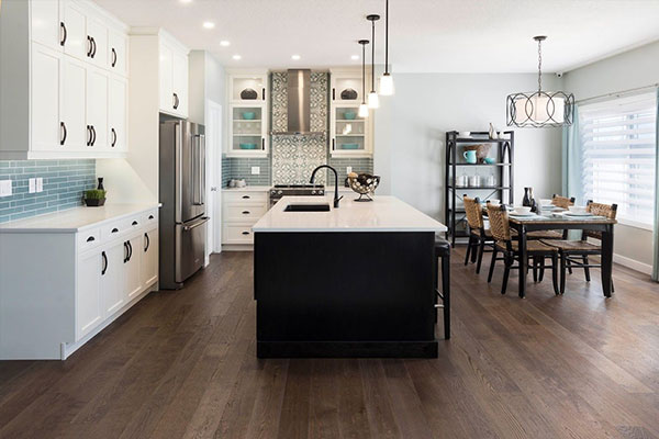 modern kitchen with darker toned hardwood flooring