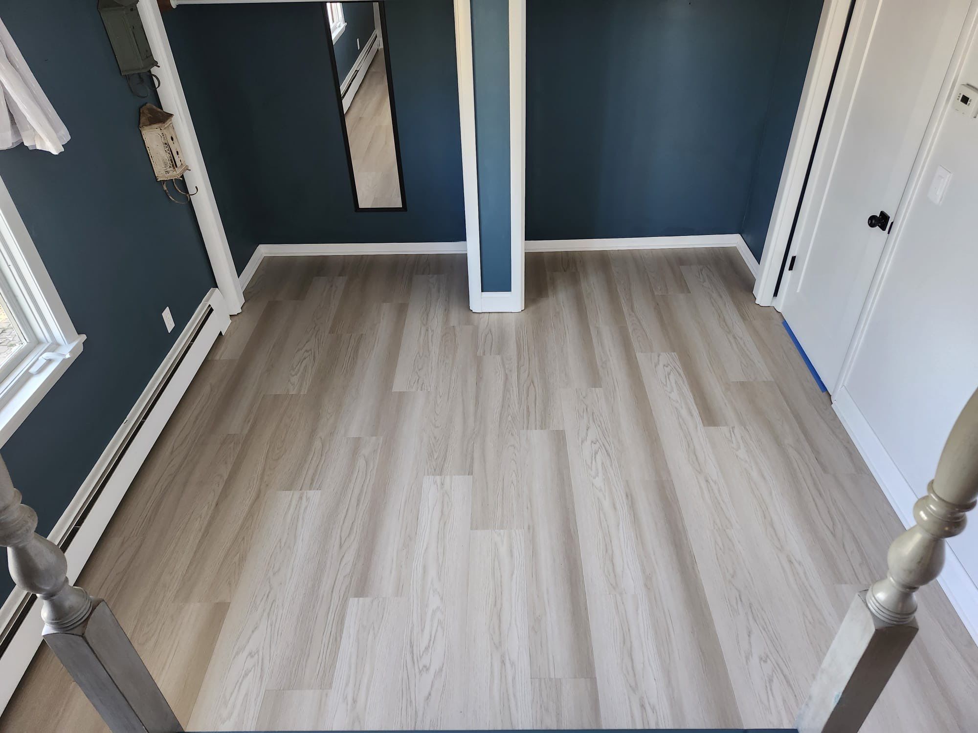 light tan laminate flooring in a bedroom