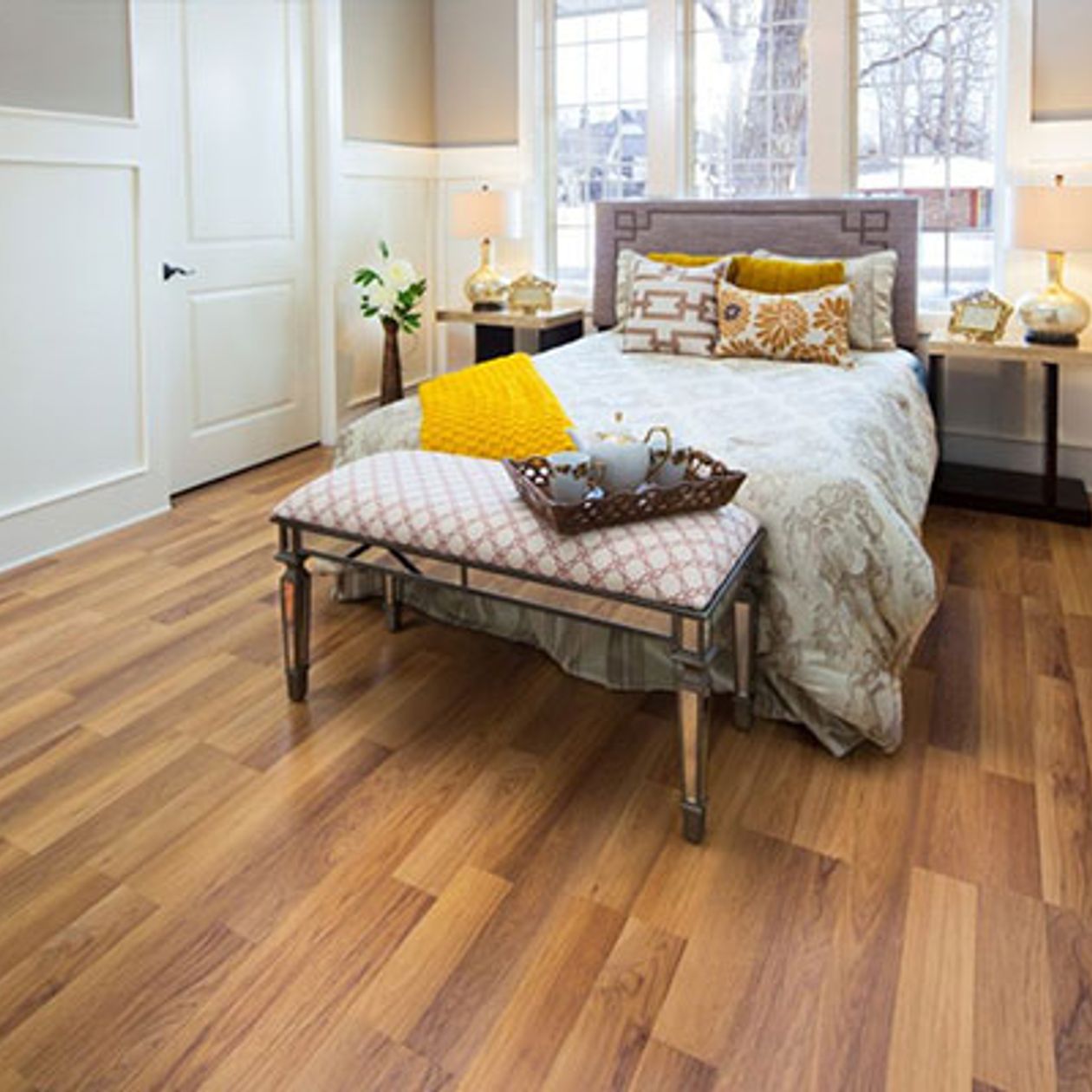 worker cleaning new wooden flooring